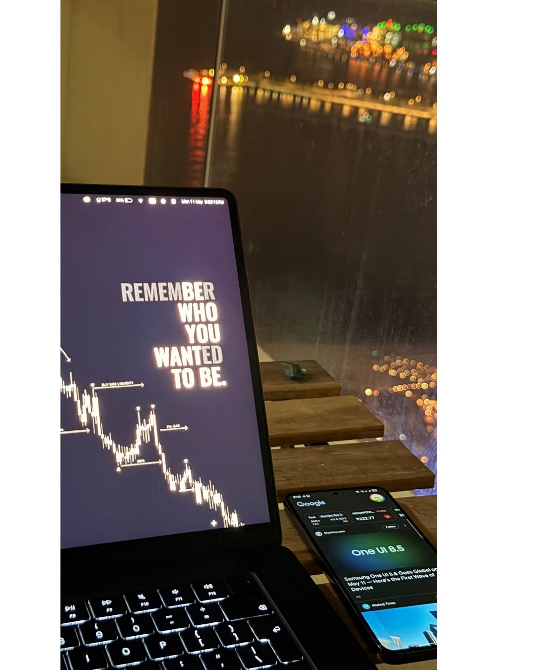 Laptop showing a growth chart at night