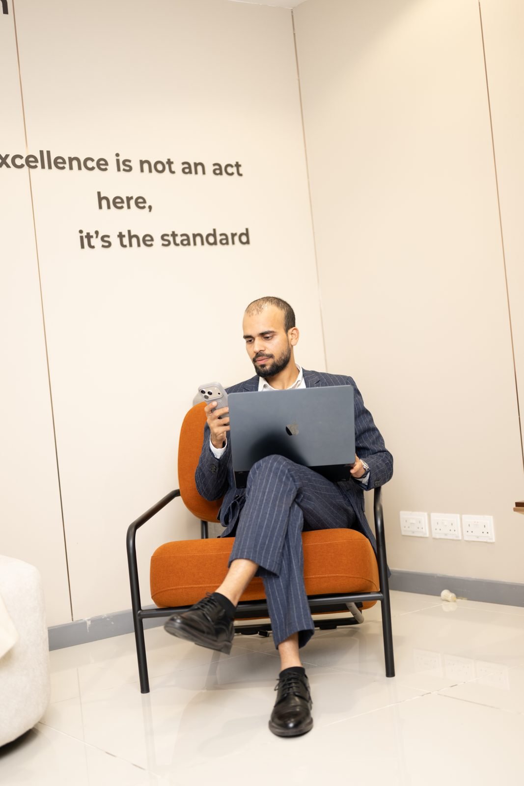 Shahbaz Khan working on a laptop